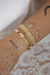 Bracelete coração cravejado e ponto de luz dourado