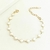 Pulseira Trevo Madrepérola Dourada - comprar online