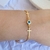 Pulseira cruz + olho grego