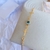 Pulseira cruz + olho grego - comprar online