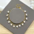 Pulseira Corações Pendurados Dourado - comprar online
