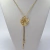 Colar Flor Gravata Cristal Dourado - loja online
