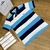 Imagem do polo lacoste listrada