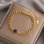 Pulseira Feminina em Camadas de Ouro com Pingente Retro Punk Gó - Santo Stylo