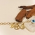 Pulseira Elo Português 19cm c/ medalha São Bento, Fé, Cifrão e Olho Grego banho ouro 18k (PUL1138) - comprar online