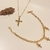 Conjunto Colar 45cm veneziana c/ crucifixo + brinco Ponto de Luz + Pulseira cartier c/ pingentes crucifixo banho Ouro 18k (MIX1091)