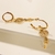 Brinco Argola Articulada Médio 0,8mm Pingente Coração Cravejado Micro Zircônias e Chave banho ouro 18k (ARG1344) na internet