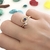 Anel Olho Grego com solitário no mesmo aro cravejado em micro zircônias cristal e marinho banho Ouro 18k (AN1605)