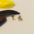 Brinco design Crucifixo Tarraxa Bebê banho ouro 18k (PQ1470)