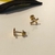 Brinco design Crucifixo Tarraxa Bebê banho ouro 18k (PQ1470) - comprar online