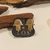 Brinco Mão de Fátima c/ caneta de Ródio banho ouro 18k (PQ1478)