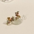 Brinco Ear Cuff Pétalas em Micro Zircônias coloridas banho Ouro 18k (EAR1555) na internet