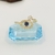 Anel Olho Grego com solitário no mesmo aro cravejado em micro zircônias cristal e marinho banho Ouro 18k (AN1605) na internet