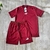 Conjunto masculino da Puma, composto por camiseta e short na cor vermelha, com detalhes em branco.