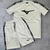 Conjunto masculino Mizuno Dry-Fit, composto por camiseta e short na cor branca, com detalhes em preto e logo da Mizuno.