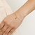 Pulseira Rommanel banhada a ouro 18k com zircônia pendurada - tam.19 na internet