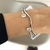 BRACELETE DUAS PEDRAS ZIRCÔNIA BANHADO A OURO 18K na internet