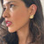 BRINCO LEQUE BANHADO A OURO 18K