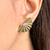 BRINCO LEQUE BANHADO A OURO 18K - comprar online