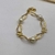 Pulseira Perola Shel com Laço Pequeno Banhado a ouro 18k - comprar online