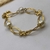 Pulseira Perola Shel com Laço Pequeno Banhado a ouro 18k na internet