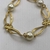 Pulseira Perola Shel com Laço Pequeno Banhado a ouro 18k - Realce semijoias