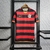 Camisa retrô do Flamengo 2009, com listras vermelhas e pretas, logo da Nike e do clube em destaque.