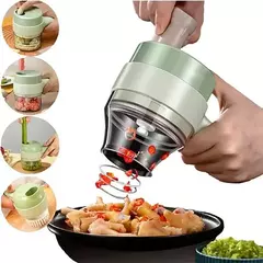 Cortador elétrico de legumes 4 em 1, sem fio, em uso para picar ingredientes em uma tigela.