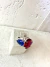 ANEL DE RODIO DE PEDRA AZUL E VERMELHO - comprar online