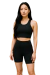 Conjunto fitness feminino preto acompanha short meia coxa com bolsos laterais e TOP.