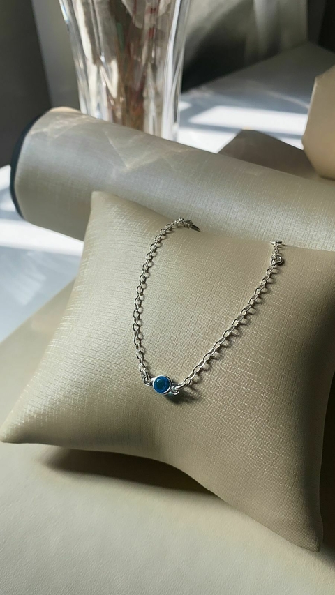 PULSEIRA INFANTIL COM PONTO DE LUZ AZUL