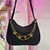 Bolsa negro con cadenas