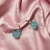 Aretes patito brillo en internet
