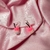 Aretes bebida rosa