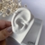 Piercing com zircônia na internet