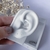 Piercing com zircônias na internet