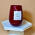 Vela aromática de cera de abelha em recipiente vermelho, rotulada como "Love Flame", ideal para o Dia dos Namorados.