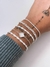 Pulseira trevo em madrepérola na internet