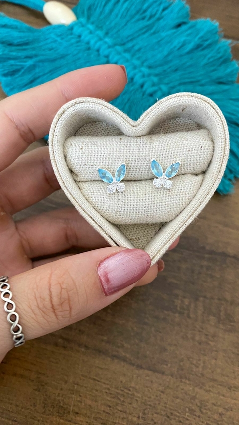 Brinco borboleta agua marinha