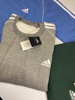 Buzo Adidas retro gris en internet