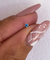 Piercing turquesa