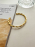Bracelete Torcido - Banhado a Ouro na internet