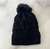 GORRO CON PIEL, POMPON Y PERLAS