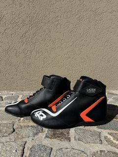 BOTAS NEGRAS CON NARANJA en internet