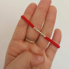 Pulsera con Ocho Pelotitas.