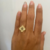 Anel regulável flor folheado a ouro 18k