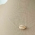 COLAR CHOKER FIO DE NYLON COM BUZIO