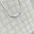 GARGANTILHA CRAVEJADA COM ZIRCONIAS VERDE