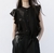 Blusa negra Olanes en internet
