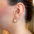 BRINCO EAR HOOK COM PÉROLA BANHADO NO OURO ROSE - comprar online